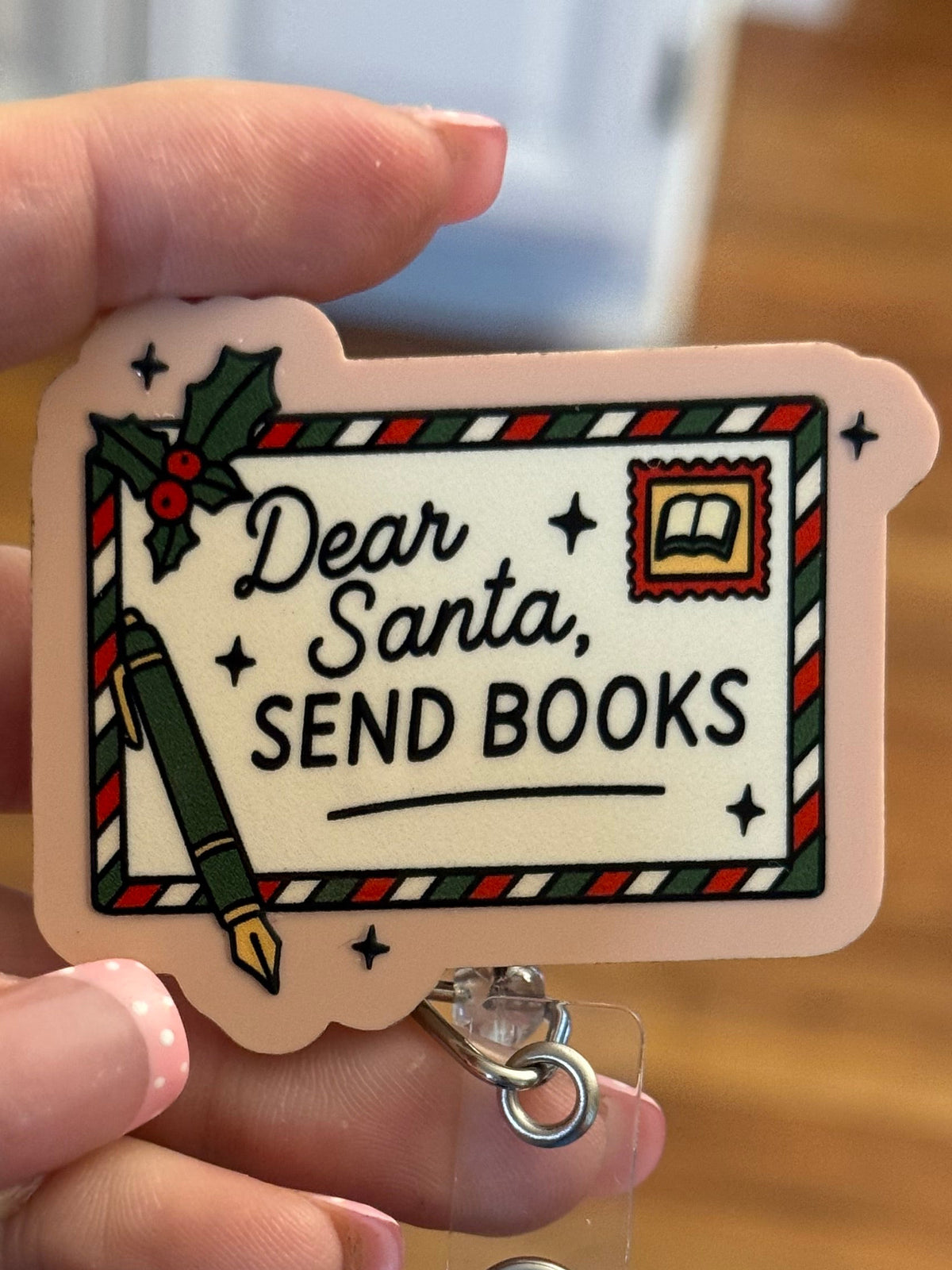 Santa Books Badge Reel